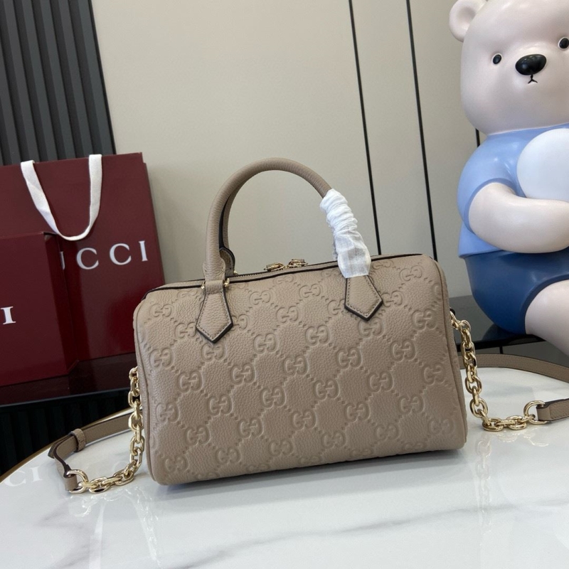 G*u*i top handle bags